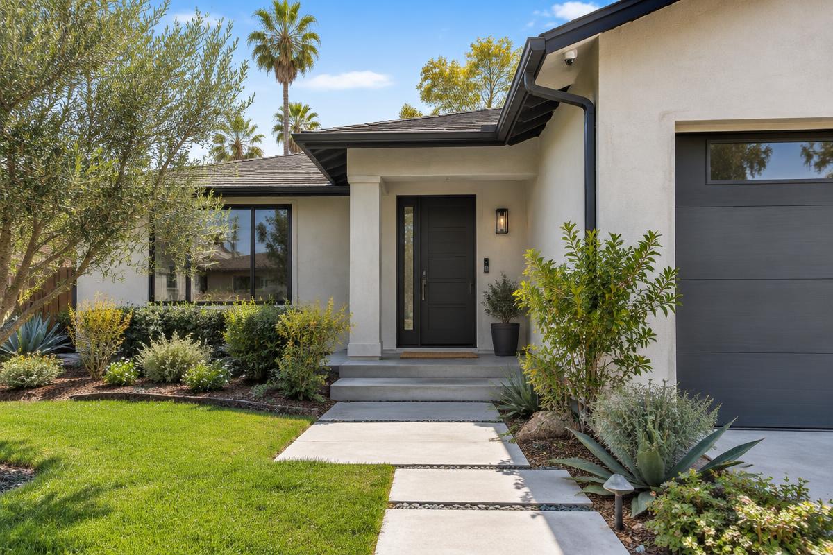 Contemporary residential entrance with a smart lock, doorbell and discreet security camera